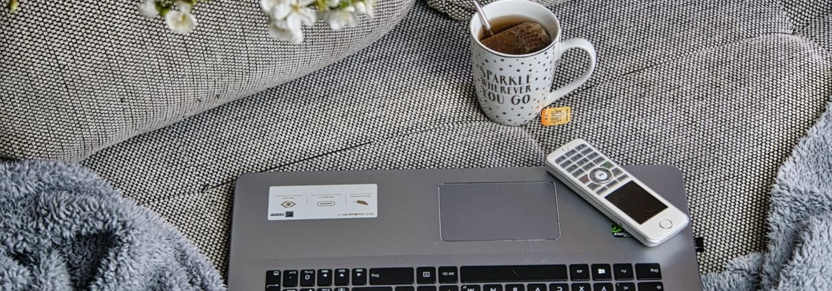 a laptop and a cup of tea
