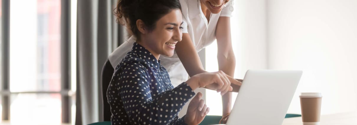 women looking at a laptop