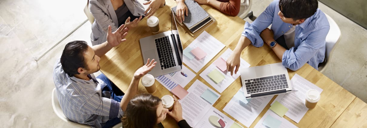 high angle view of a team of asian and caucasian corporate executives
